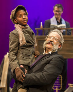 Ikenna Ogbogu (Tiny Tim) and Geoff Elliott (Scrooge) in ANW's A Christmas Carol 2014.