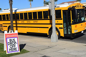 A school bus arriving at A Noise Within for a Student Matinee.