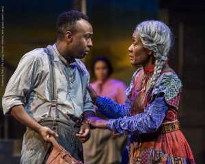 Aunt Ester holds onto Citizen Barlow's arm as he looks for guidance in Gem of the Ocean.